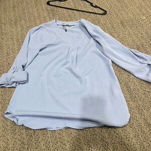 Cute baby blue blouse, never worn.